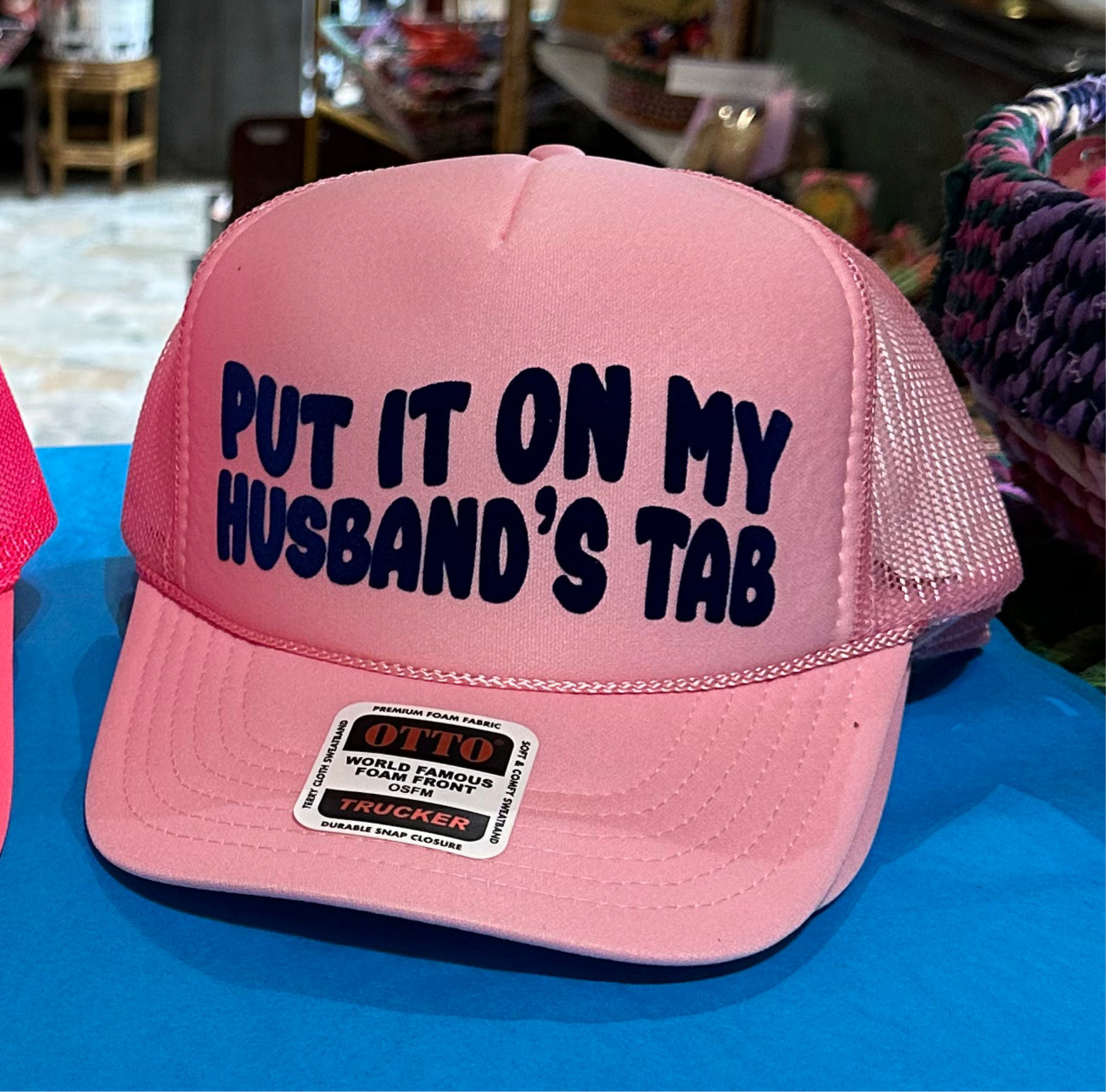 Put It On My Husband’s Tab Light Pink Trucker Hat