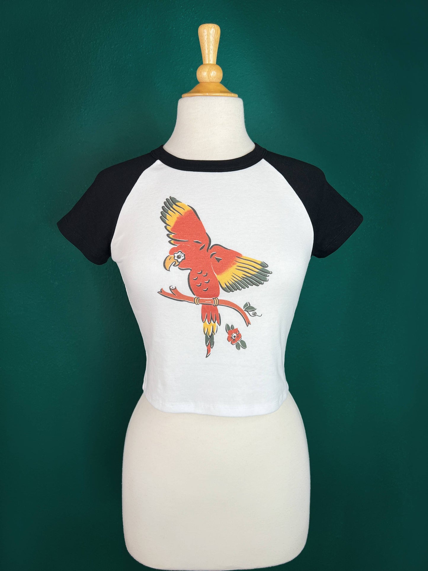 The Parrot Short Raglan Cropped Baby tee in White/Black