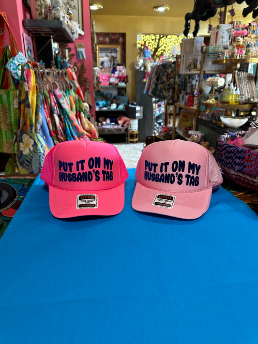 Put It On My Husband’s Tab Light Pink Trucker Hat