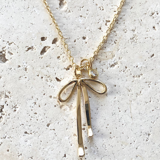 Melted droopy ribbon bow charm necklace